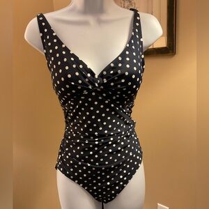 Navy and white polka dot one piece swimsuit with adjustable straps. Size Medium